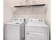 Laundry room with side-by-side washer and dryer, and overhead shelving at 3345 Pleasant Willow Ct, Brandon, FL 33511