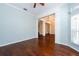 Living room with hardwood floors and view to other rooms at 4017 Eagleflight Ln, Land O Lakes, FL 34639