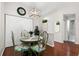 Bright dining area with table, chairs, and hardwood floors at 4224 Chesterfield Cir, Palm Harbor, FL 34683