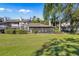 Backyard view showing patio and surrounding landscape at 4234 Golf Club Ln, Tampa, FL 33618