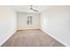 Bright bedroom with ceiling fan and window shutters at 4312 Silver Falls Dr, Land O Lakes, FL 34639