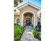 Welcoming front entry with decorative planters and a brick pathway at 4851 Windmill Palm Ne Ter, St Petersburg, FL 33703