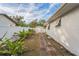 Landscaped backyard with brick pathway and shed at 500 Randolph Rd, Venice, FL 34293