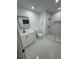 Bright bathroom with modern vanity, framed mirror and step in shower at 500 Randolph Rd, Venice, FL 34293