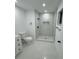 Modern bathroom featuring a stylish shower with pebble floor and sleek, black fixtures at 500 Randolph Rd, Venice, FL 34293