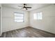 This bedroom offers natural lighting, ceiling fan, and laminate flooring at 500 Randolph Rd, Venice, FL 34293