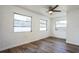 Bedroom featuring plenty of natural light, ceiling fan, and laminate flooring at 500 Randolph Rd, Venice, FL 34293