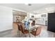 Modern dining area with glass table and brown leather chairs at 500 Randolph Rd, Venice, FL 34293