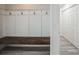 Inviting entryway with built-in bench and coat hooks at 500 Randolph Rd, Venice, FL 34293