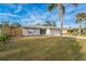 Attractive curb appeal featuring a well-maintained lawn and updated home exterior at 500 Randolph Rd, Venice, FL 34293