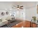 Open living room featuring hardwood floors, stylish furniture, and natural light at 500 Randolph Rd, Venice, FL 34293
