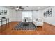 Spacious living room with hardwood floors and barn doors at 500 Randolph Rd, Venice, FL 34293