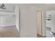 Bright hallway with tile floors and access to bedrooms at 5028 School Rd, Land O Lakes, FL 34638