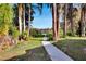 Pathway to lakefront with mature trees at 5028 School Rd, Land O Lakes, FL 34638