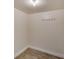 Small storage room with wood-look flooring at 5028 School Rd, Land O Lakes, FL 34638