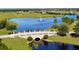 Picturesque bridge over the water with green landscaping around at 5317 Lake Venice Dr, Wimauma, FL 33598
