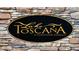 Lake Toscana community sign on a stone wall at 5317 Lake Venice Dr, Wimauma, FL 33598