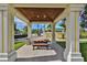 Relaxing covered picnic area with wooden table at 5440 Sandy Shell Dr, Apollo Beach, FL 33572