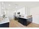 Modern kitchen with white and dark cabinets and quartz countertops at 6153 25Th S St, St Petersburg, FL 33712