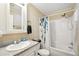 Clean bathroom with shower/tub combo, toilet, and vanity at 6449 Wendell Dr, Wesley Chapel, FL 33544