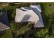 Aerial view of the house showcasing its roofline and landscaping at 728 Thistlelake Dr, Venice, FL 34293