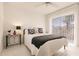 Charming bedroom with a queen-size bed and sliding glass doors at 728 Thistlelake Dr, Venice, FL 34293