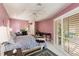 Comfortable bedroom with a king-size bed and built-in desk at 728 Thistlelake Dr, Venice, FL 34293