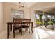 Bright dining area with table and chairs near sliding doors at 728 Thistlelake Dr, Venice, FL 34293