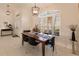 Bright dining room with a wooden table and six chairs at 728 Thistlelake Dr, Venice, FL 34293
