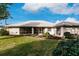 Single-story home with a large backyard and screened patio at 728 Thistlelake Dr, Venice, FL 34293
