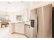 Modern kitchen with stainless steel appliances and white cabinets at 728 Thistlelake Dr, Venice, FL 34293