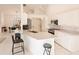 Bright kitchen with stainless steel appliances and white cabinetry at 728 Thistlelake Dr, Venice, FL 34293