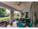 Cozy screened patio with seating and grill, perfect for outdoor dining at 728 Thistlelake Dr, Venice, FL 34293