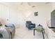 Relaxing sitting room with comfortable seating and a large TV at 728 Thistlelake Dr, Venice, FL 34293