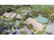 Community clubhouse with pool, tennis courts, and golf course views at 8041 Green Pines Ter, Spring Hill, FL 34606