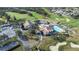 Aerial view of community with clubhouse, pool, and parking at 8041 Green Pines Ter, Spring Hill, FL 34606