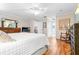 Bright bedroom featuring wood floors and a ceiling fan at 8041 Green Pines Ter, Spring Hill, FL 34606