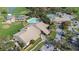 Aerial view of community clubhouse, pool, and parking at 8041 Green Pines Ter, Spring Hill, FL 34606