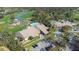 Aerial view of community clubhouse near pool and tennis at 8041 Green Pines Ter, Spring Hill, FL 34606