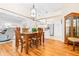 Charming dining area featuring a wood table and chairs, adjacent to the kitchen at 8041 Green Pines Ter, Spring Hill, FL 34606