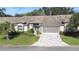 One-story home with double garage and paved driveway at 8041 Green Pines Ter, Spring Hill, FL 34606