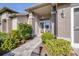 Front entry with double doors and brick facade at 8041 Green Pines Ter, Spring Hill, FL 34606