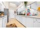 White kitchen cabinets, stainless steel appliances, and a view into the dining area at 8041 Green Pines Ter, Spring Hill, FL 34606