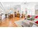 Open concept living and dining area with hardwood floors at 8041 Green Pines Ter, Spring Hill, FL 34606