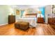 Spacious main bedroom with wood flooring and large dresser at 8041 Green Pines Ter, Spring Hill, FL 34606