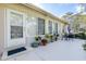 Relaxing patio with seating area and potted plants at 8041 Green Pines Ter, Spring Hill, FL 34606