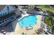 Community pool with spa and plenty of seating at 8041 Green Pines Ter, Spring Hill, FL 34606
