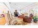Sunroom features a ceiling fan and comfy seating at 8041 Green Pines Ter, Spring Hill, FL 34606