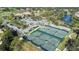 Aerial view of community tennis courts with players at 8041 Green Pines Ter, Spring Hill, FL 34606