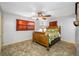 Bedroom with wood bed frame and tiled floors at 8573 109Th Way, Seminole, FL 33772